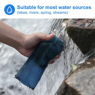 HygieniSafe collapsible filter bottle being filled from an outdoor water source