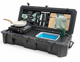 VOZ portable camp kitchen angled front view with cooking station, sink, rechargeable faucet and utensils