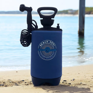 Beach Soul Ocean Rise PRO portable camping shower with manual pump at the beach