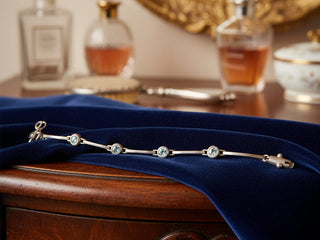 925 Sterling Silver Blue Topaz Bracelet by Dee Berkley on blue velvet